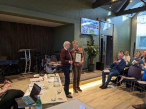 HF photo Photo of Cllr McFarlane presenting award to Helen Fleming