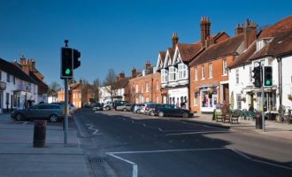 View along the busy High Steet in Odiham, Hampshire, Uk
